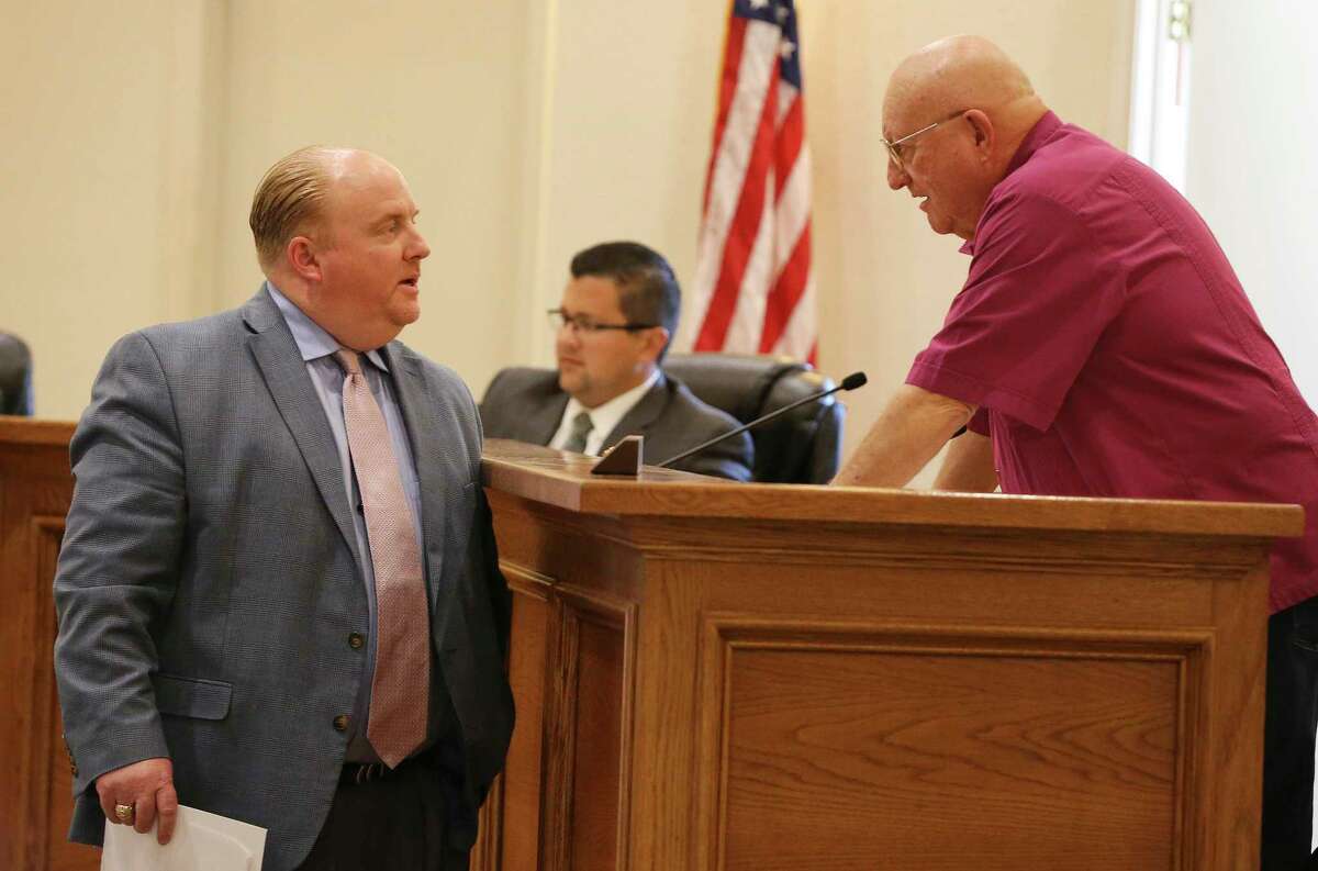 Castle Hills City Manager Ryan Rapelye (left) speaks with Councilman Clyde R. “Skip” McCormick before the Castle Hills City Council was to meet on Tuesday. The Council was divided on the issue of Sylvia Gonzalez's council seat being declared vacant but in the end voted to set a special election for November to fill it and another soon-to-be vacant seat (Kin Man Hui/San Antonio Express-News)
