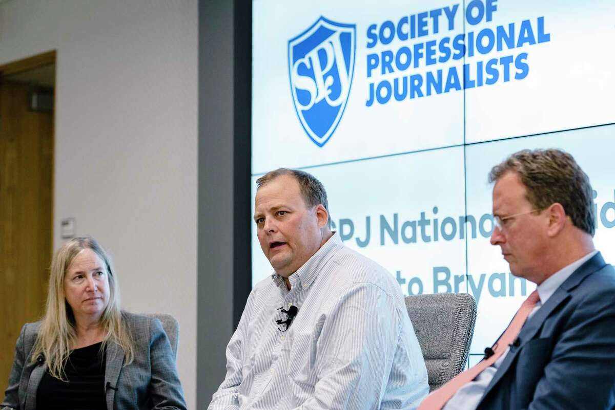 Freelance journalist Bryan Carmody, center, whose home was raided by the San Francisco Police Department, speaks during a Q&A with the Society of Professional Journalists president J. Alex Tarquinio, left, and his lawyer Thomas Burke, in San Francisco, Calif, on Tuesday, Aug. 13, 2019.