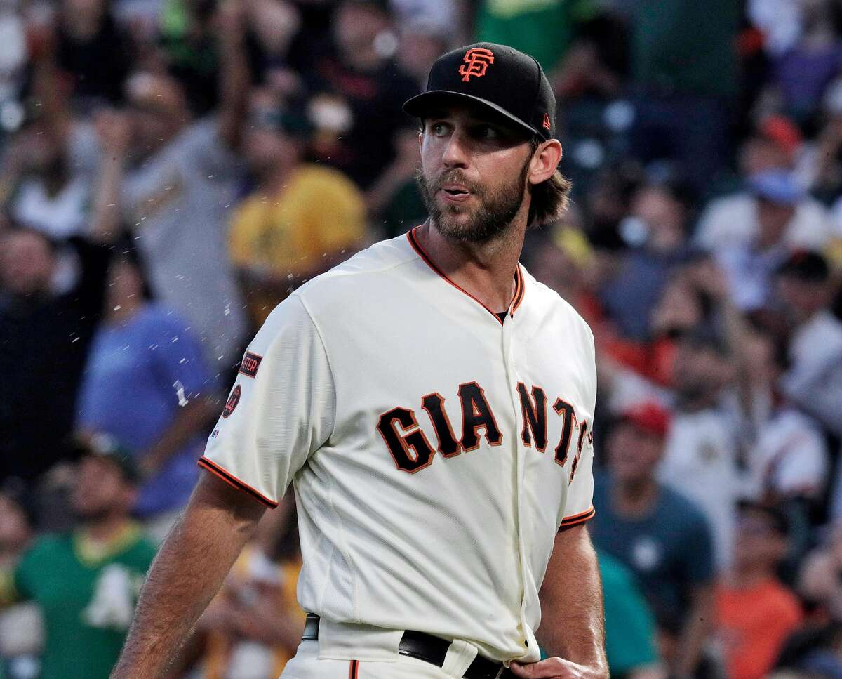 Madison Bumgarner (40) spits as he watches the flight of Stephen PIscotty's (25) solo homerun in the fifth inning as the San Francisco Giants played the Oakland Athletics at Oracle Park in San Francisco, Calif., on Tuesday, August 13, 2019.