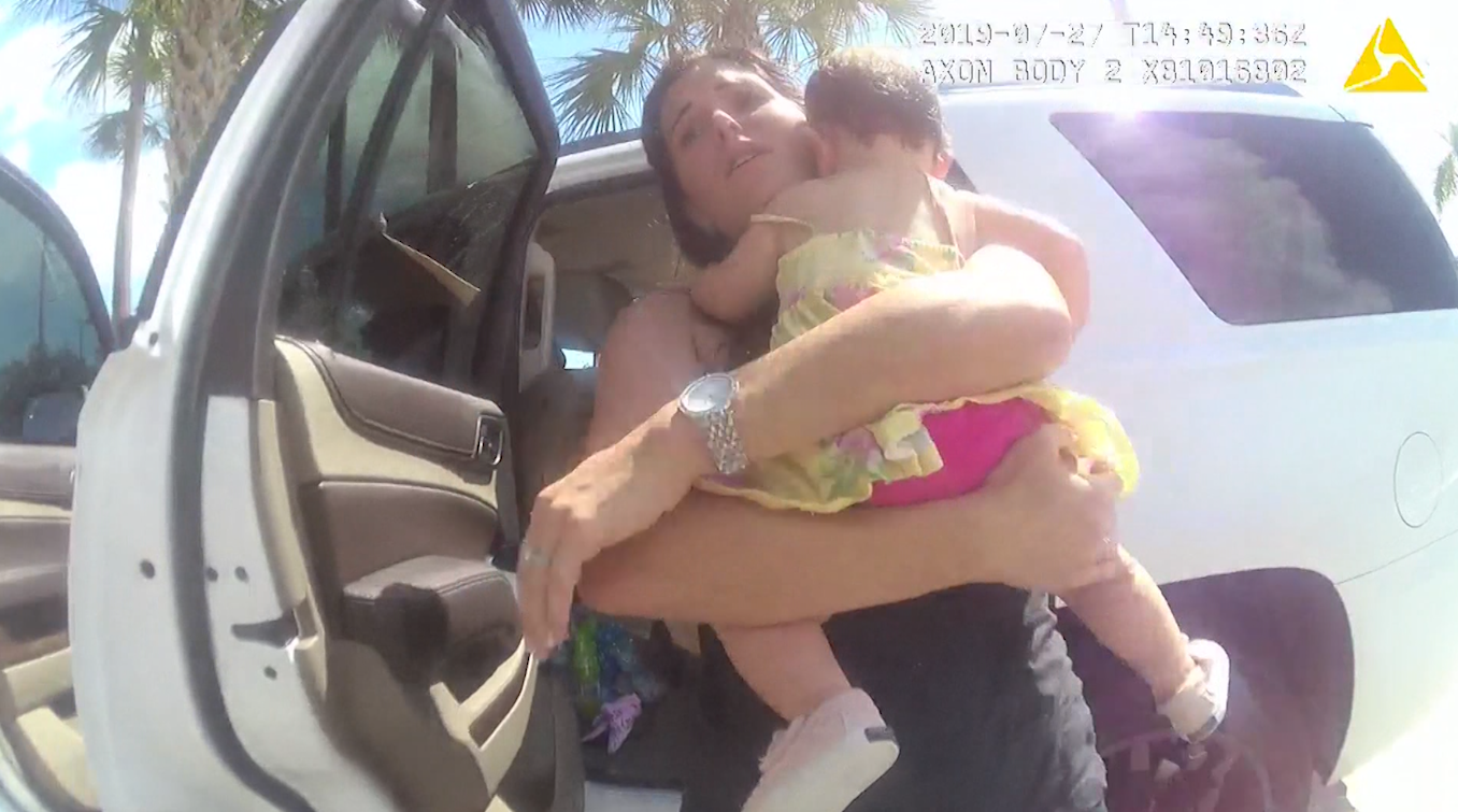 Caught on video: Police smash window to rescue baby girl trapped inside SUV