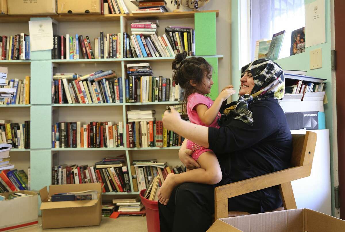 Halide Altikardes (right) plays with her granddaughter, Nil Oguz, at Dead Tree Books while Altikardes' son was shopping for books on Wednesday, Aug. 7, 2019. Dead Tree Books is the only bookstore on San Antonio's South Side and recently had put out an online plea for help to keep the business alive. Since then owners Lisa and Kenny Johnson have seen an uptick in walk-in traffic and online orders. The Johnson's started the bookstore in 2016 but the business has struggled to get customers. With the recent social media plea, people have come from all parts of town to patronize the bookstore and, for now, have staved off closure. (Kin Man Hui/San Antonio Express-News)