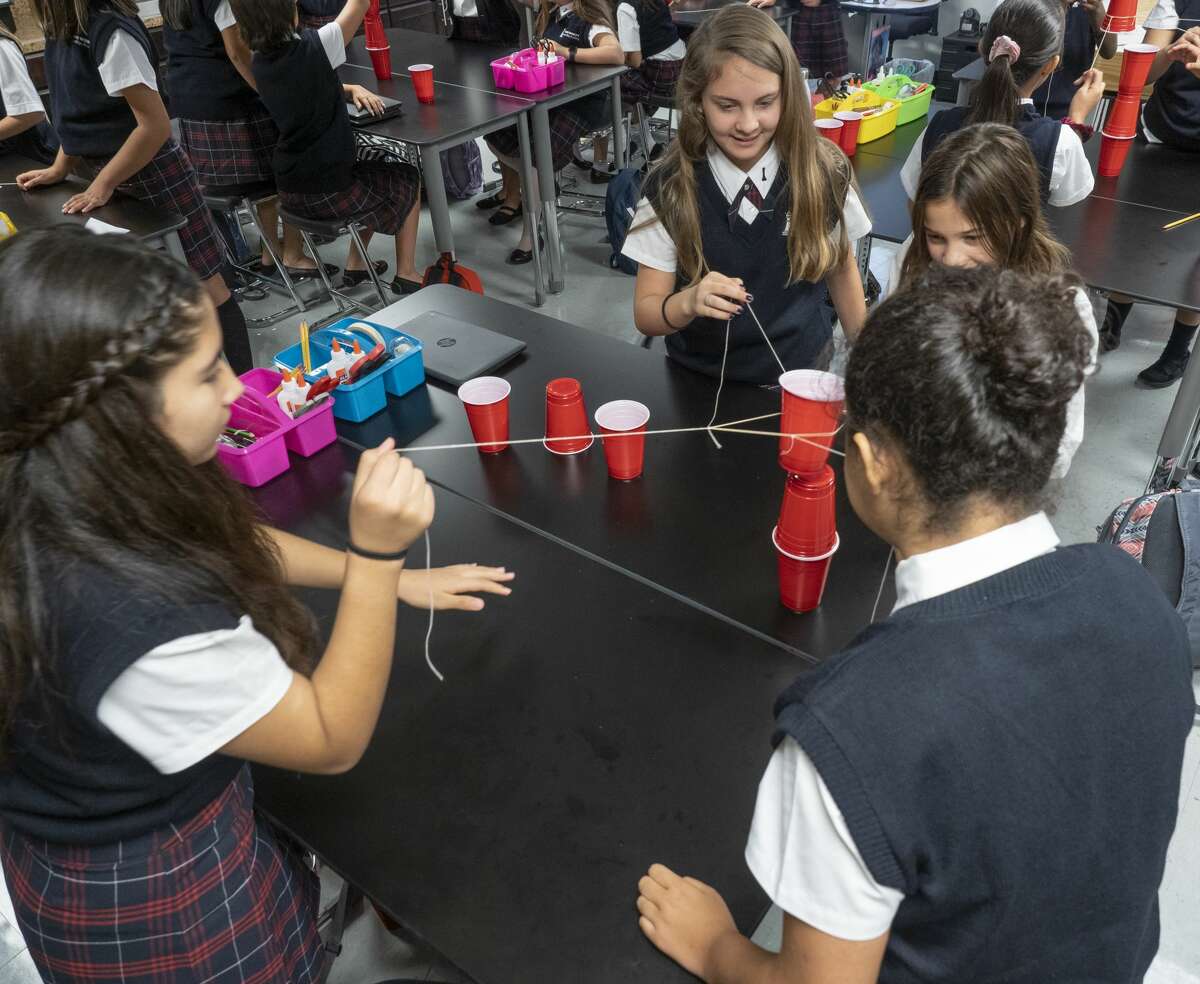 FILE PHOTO: Students in a STEM class use teamwork to build a tower made of cups 08/14/19 morning for the first day at the new Young Women's Leadership Academy. Tim Fischer/Reporter-Telegram