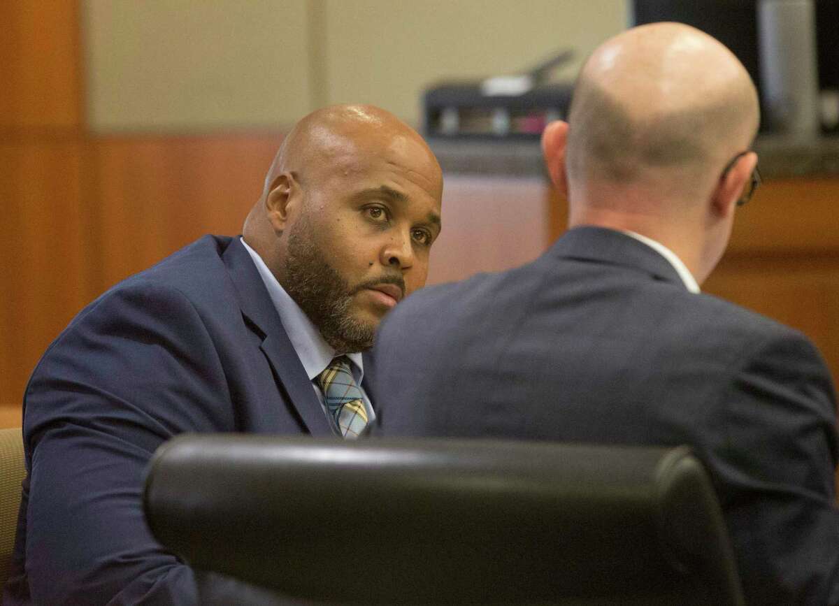 Former Harris County Sheriff's Office deputy Cameron Brewer talks to his attorney Edward McClees during his trial at State District Judge Josh Hill's courtroom at Harris County Civil Courthouse on Thursday, Aug. 1, 2019, in Houston. Brewer is charged with aggravated assault by a public servant for the death of 34-year-old Danny Ray Thomas in 2018.