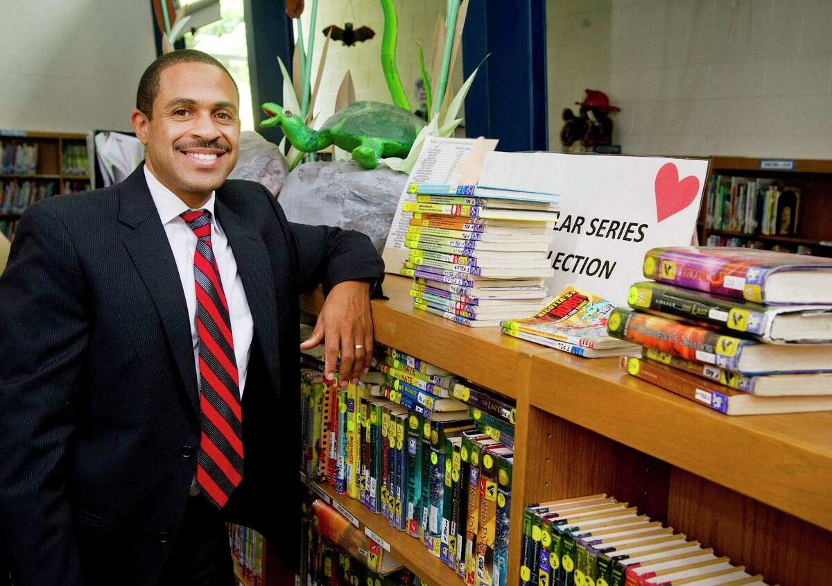 Northeast Elementary School Principal Hubert Gordon poses for a photo in the school in Stamford, Conn., on Thursday, August 14, 2014.