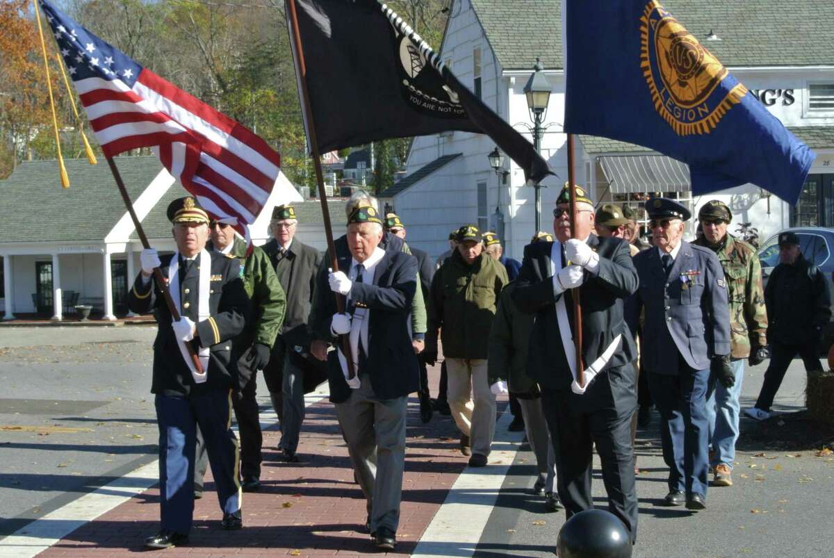 Representing American Legion Post 86, Ken Shewitz, left, marches in Wilton’s Veterans Day parade with Alex Ruskewich, center, and Tom Moore.