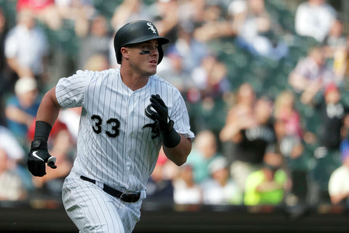Chicago White Sox's James McCann watches his grand slam off Houston Astros relief pitcher Ryan Pressly during the eighth inning of a baseball game Wednesday, Aug. 14, 2019, in Chicago. (AP Photo/Charles Rex Arbogast)