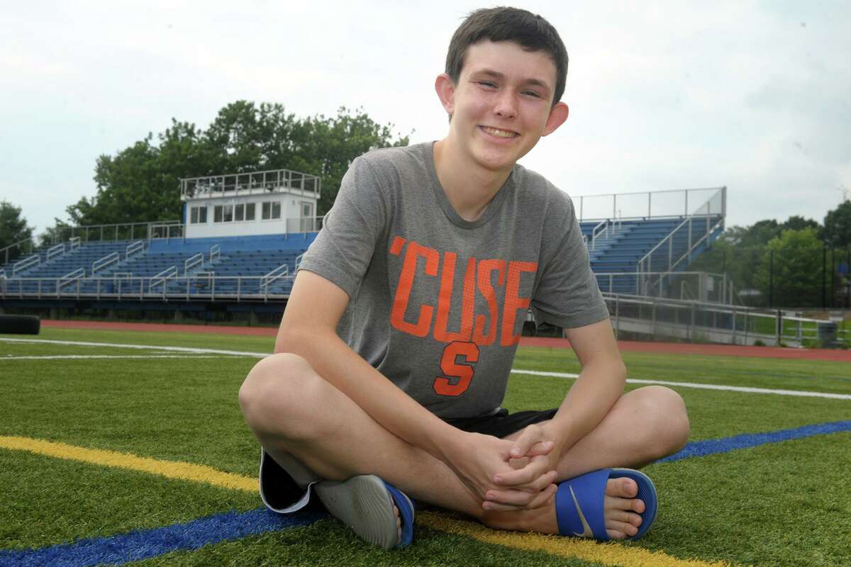 Aiden Blanc poses on one of the sports fields at Fairfield Ludlowe High School, where he will be a junior this coming school year. Blanc will be traveling to Williamsport, Pa. this week, where he will be one of four teenagers chosen to call a game at the Little League World Series for a special ESPN Kidscast.