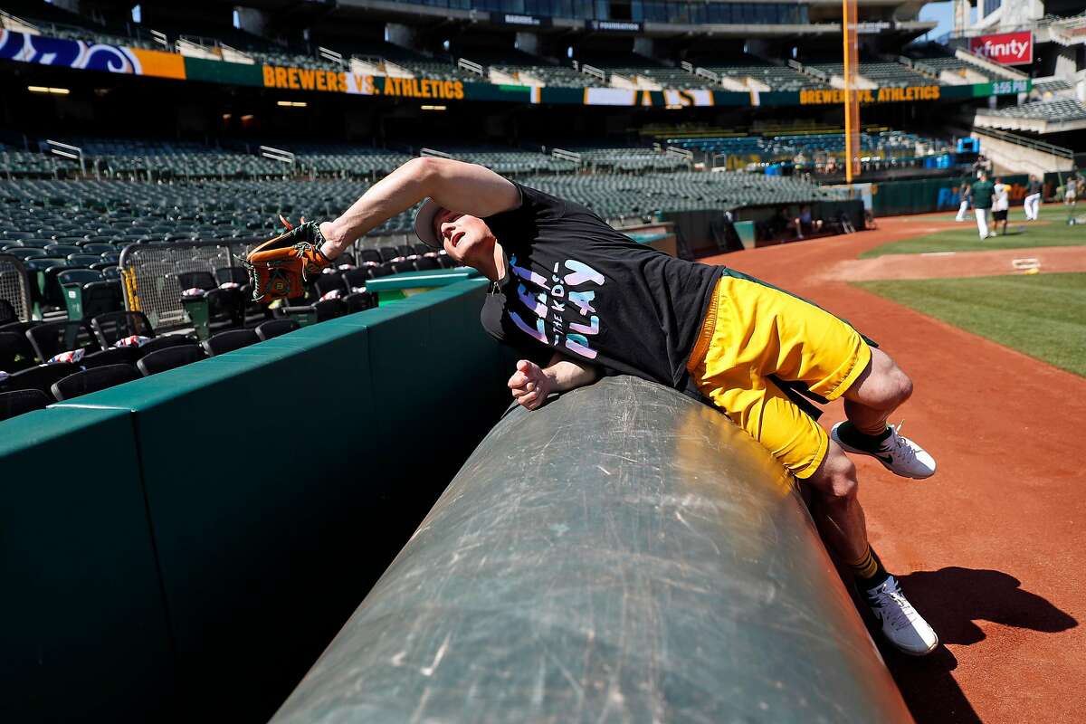 Oakland Athletics' third baseman Matt Chapman discusses the art of catching a ball near the tarp during a tour of foul territory at Oakland Coliseum in Oakland, Calif., on Wednesday, July 31, 2019.