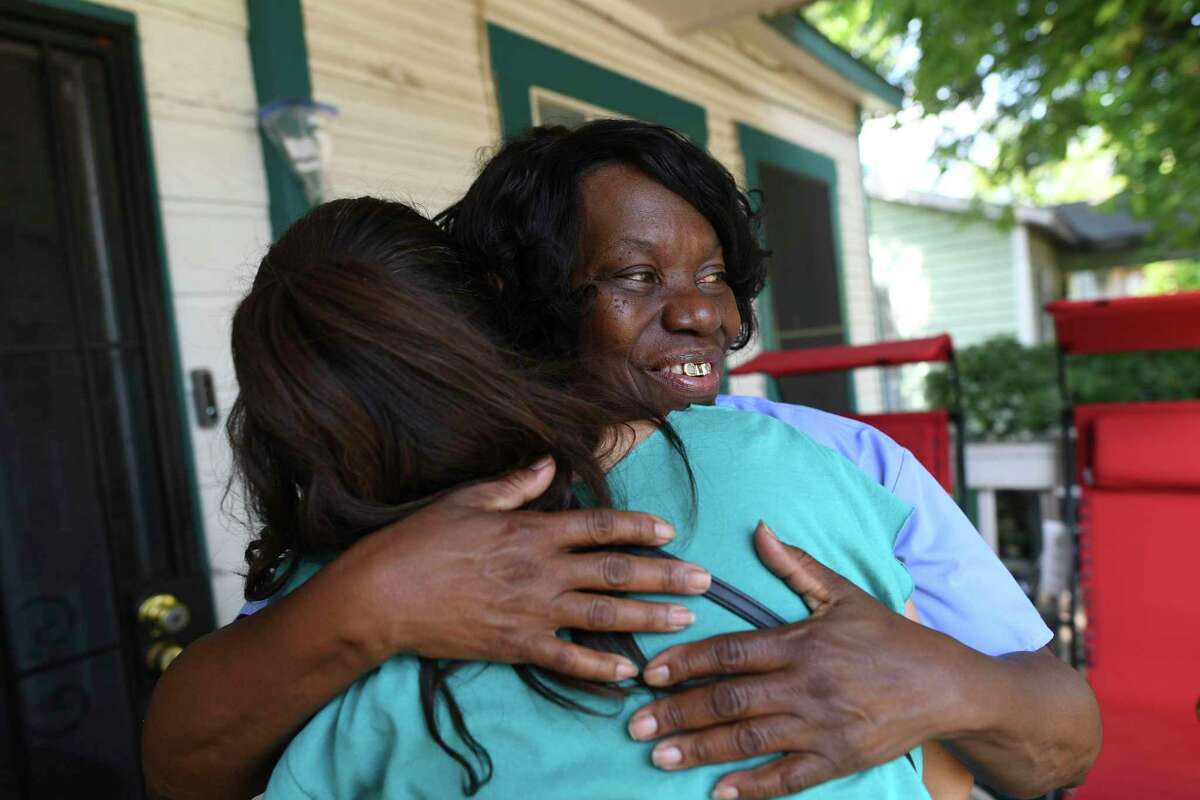 Marilyn Washington, who lives in East San Antonio, embraces Joleen Garcia, a TOP organizer and member of the city's paid sick leave commission. Washington works as a home healthcare provider and has no access to paid sick leave. She has joined the lawsuit along with TOP/MOVE to defend the city's ordinance, which mandates businesses with six to 15 employees provide a minimum of 48 paid sick hours per year. Businesses with more than 15 employees are required to provide 64 paid sick hours per year.