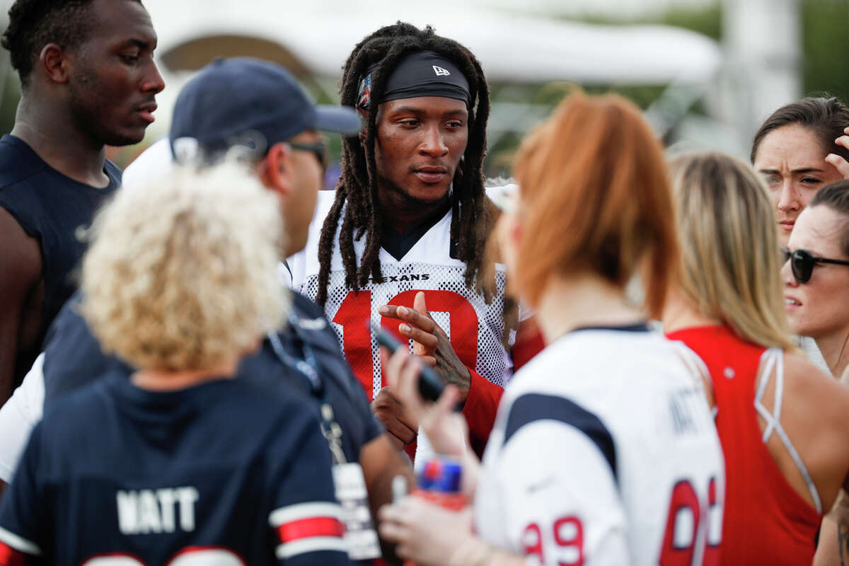 Houston Texans wide receiver DeAndre Hopkins signs autographs following a joint training camp practice with the Detroit Lions at the Houston Methodist Training Center on Thursday, Aug. 15, 2019, in Houston.