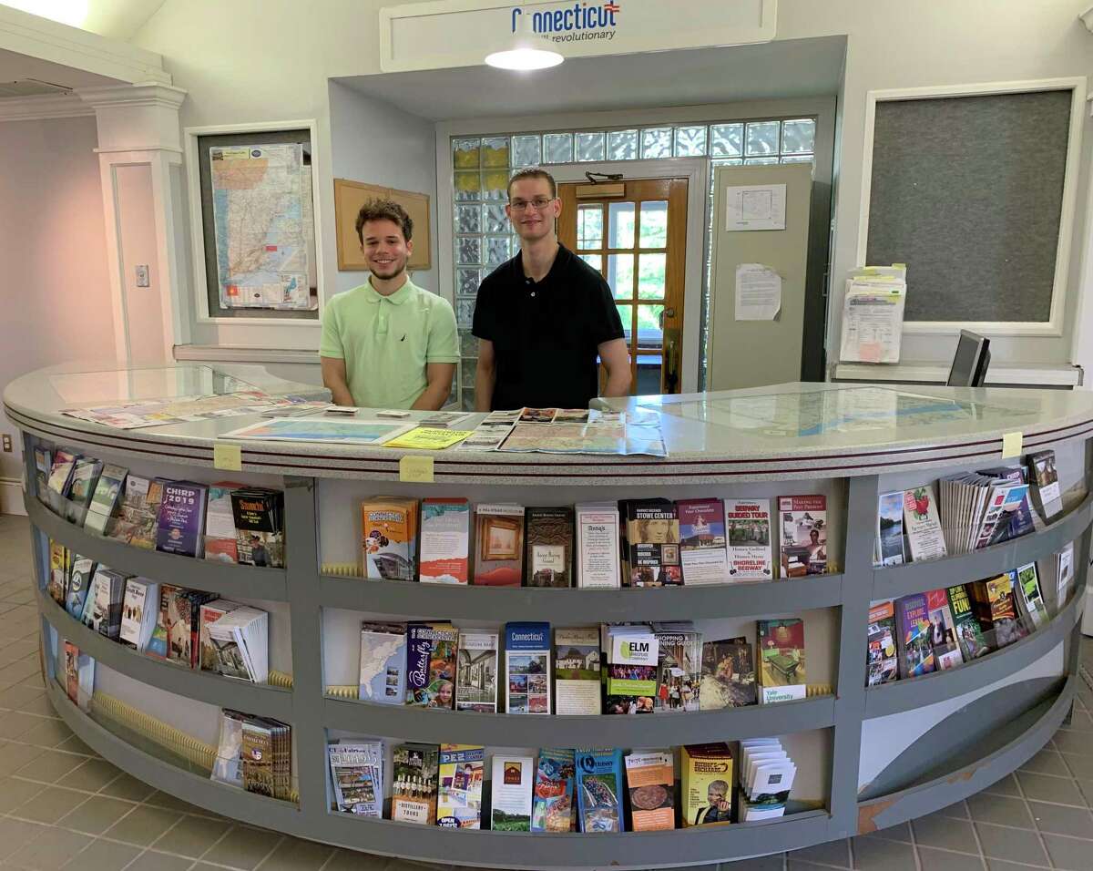 Kevin Reyes, left, and Adam Nizich staff the Tourist Information Center, which reopened Aug. 1 in the state Welcome Center off Exit 2 of I-84 eastbound.