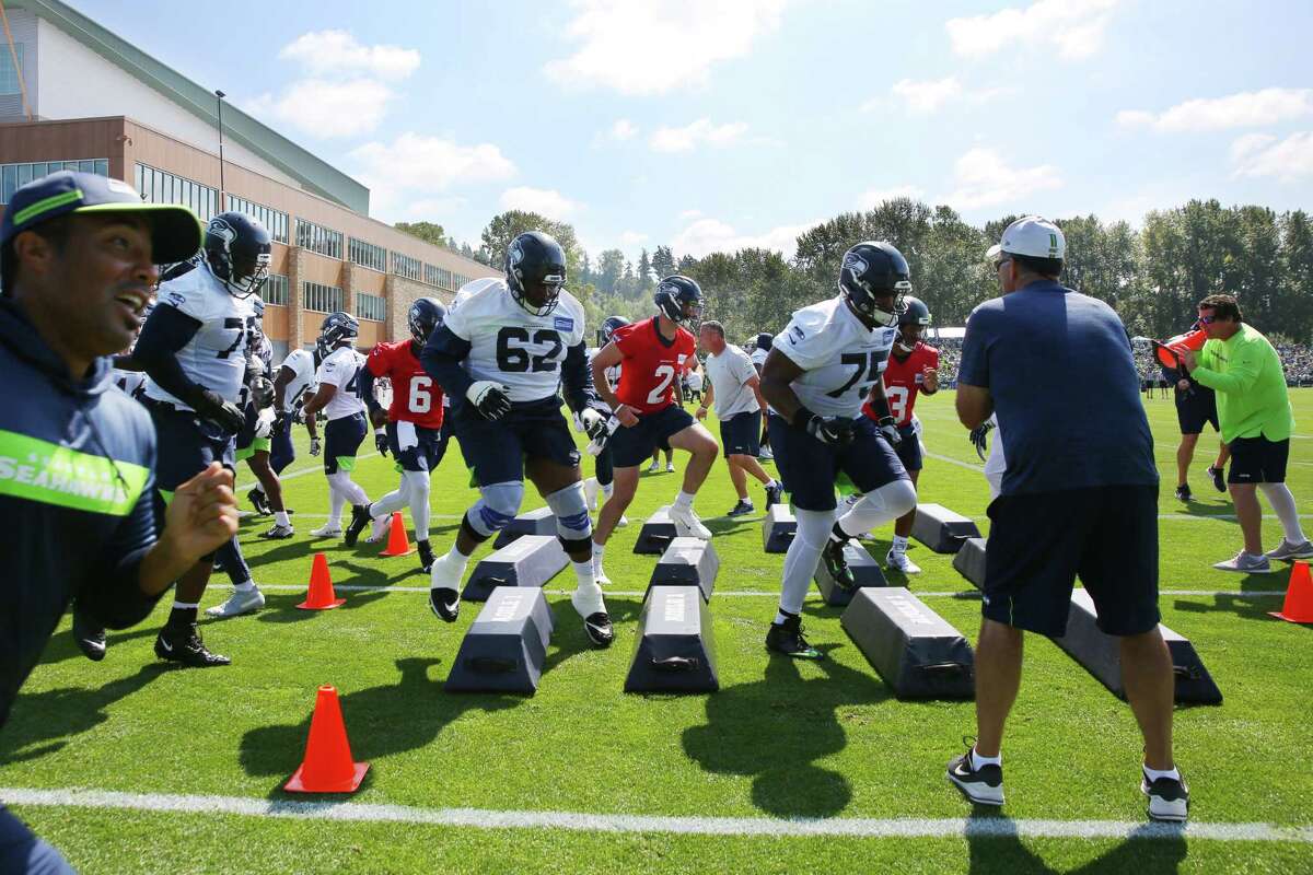 Players run drills during the Seahawks training camp, Thursday, Aug. 15, 2019.