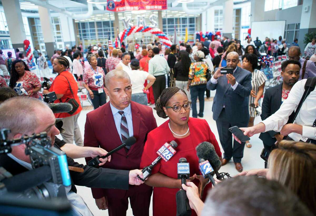 Houston Independent School District Interim Superintendent Dr. Grenita Lathan and Kashmere High School principal Reginald Bush speak with the media following a celebration marking the school's meeting of state expectations for the first time in 11 years at the school in Houston, Thursday, Aug. 15, 2019. Thursday the TEA released the state's latest school accountability ratings.