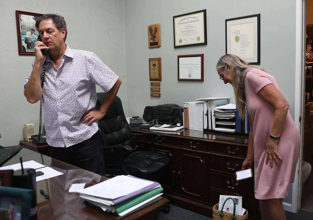 Owner Suzanne Tateosian (right) of Earth Shakes, survival supplies, with her husband insurance agent Jeffrey D. Tateosian (left) on Wednesday, Aug. 14, 2019, in Burlingame, Calif.