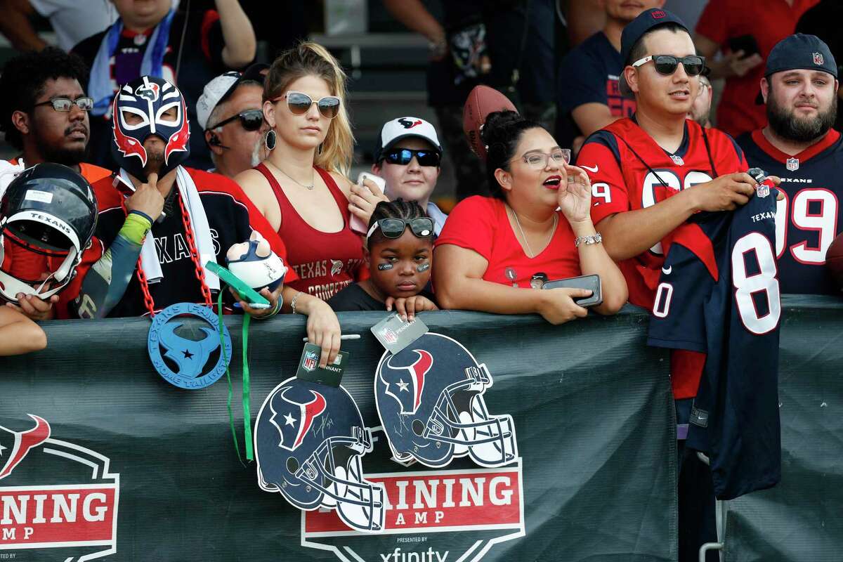 Houston Texans fans wait for players to sign autographs during a joint training camp practice with the Detroit Lions at the Houston Methodist Training Center on Thursday, Aug. 15, 2019, in Houston.