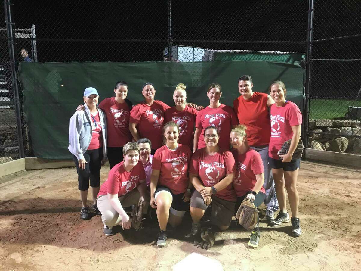 Planet Pizza celebrates after winning the championship in the Ridgefield Women’s Softball Association.