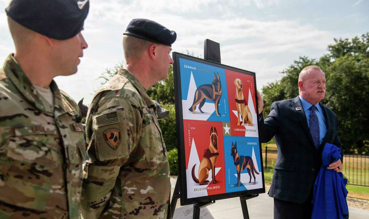 As the U.S. Postal Service unveiled a stamp honoring military working dogs, a group of handlers such as the 802nd SFS Joint Base San Antonio-Lackland's Staff Sargents Sarah Banks , left, and Brittney Turco train six year old Tarzan at Joint Base San Antonio-Lackland on Thursday, August 15th, 2019.