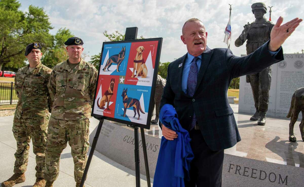 As the U.S. Postal Service unveiled a stamp honoring military working dogs, a group of handlers such as the 802nd SFS Joint Base San Antonio-Lackland's Staff Sargents Sarah Banks, top left, and Brittney Turco train six year old Tarzan at Joint Base San Antonio-Lackland on Thursday, August 15th, 2019.