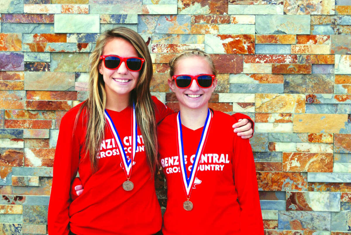 Benzie All State: Fleet of Foot: Alyssa Bennett (left) and Bryce Cutler helped Benzie Central’s cross country team take 4th place overall at the MHSAA LP Cross Country Finals last fall. The girls team came in among the top 5 for the 6th year in a row, and the boys team finished in the top 10 for the 19th year in a row. (Photo/Bryan Warrick)