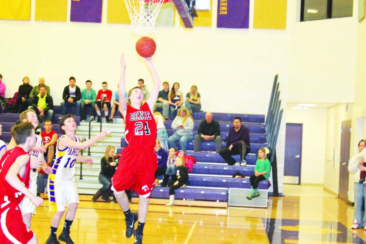 Benzie JV Passes FKT: Benzie freshman Austin Tharp jumps to put the ball in past the Panther defense.