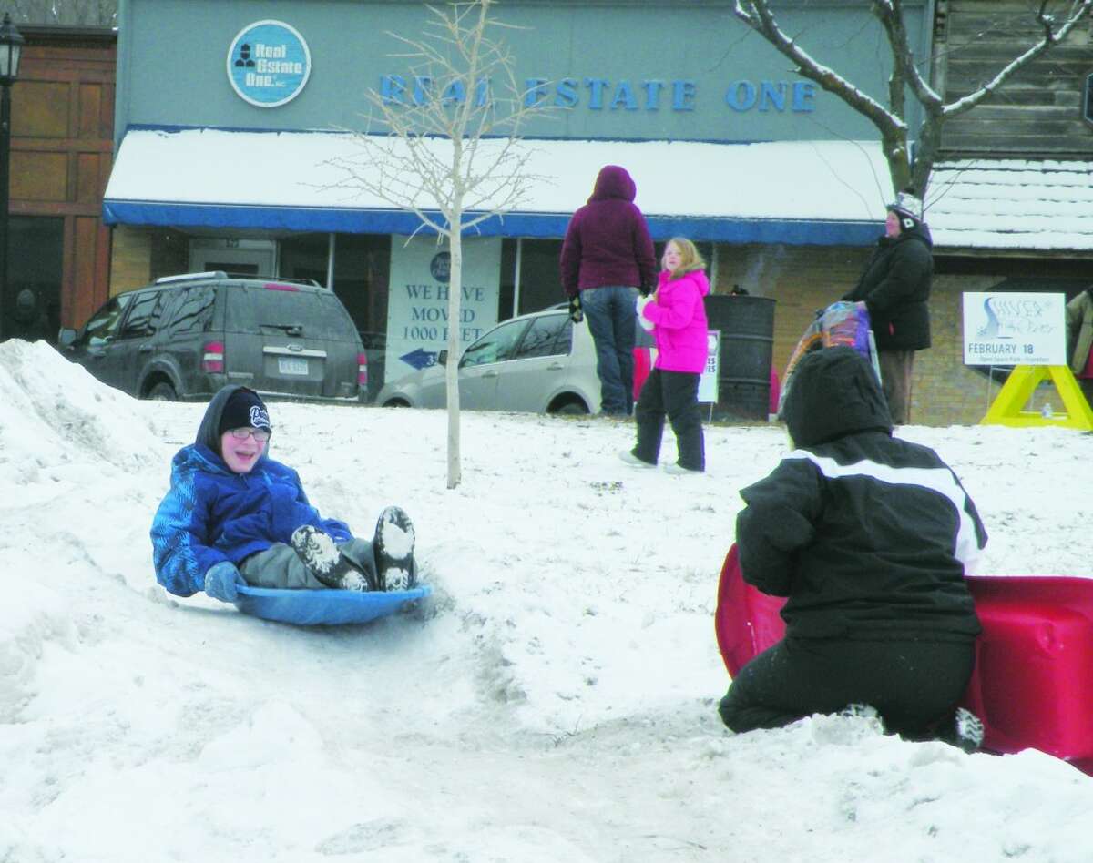 Slippery Slope: Children play on Snow Mountain at Frankfort’s Shiver by the River winter festival, just one of the many children’s activities taking place throughout the day.Other activities include bowling on Main Street, horse drawn carriage rides and lunch in the park.