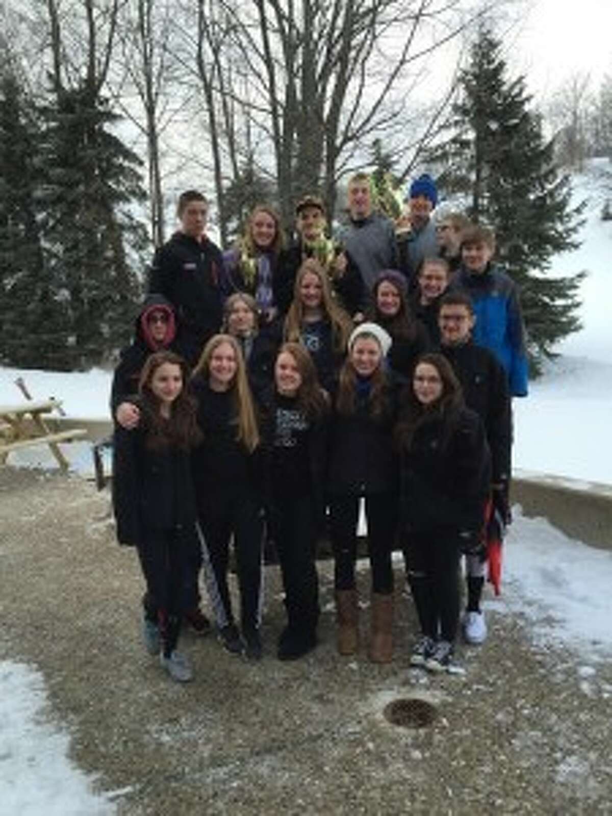 HOME CHAMPS: The Benzie/Frankfort joint ski team hold up their trophies after their home invite at Crystal Mountain. (Courtesy photo)