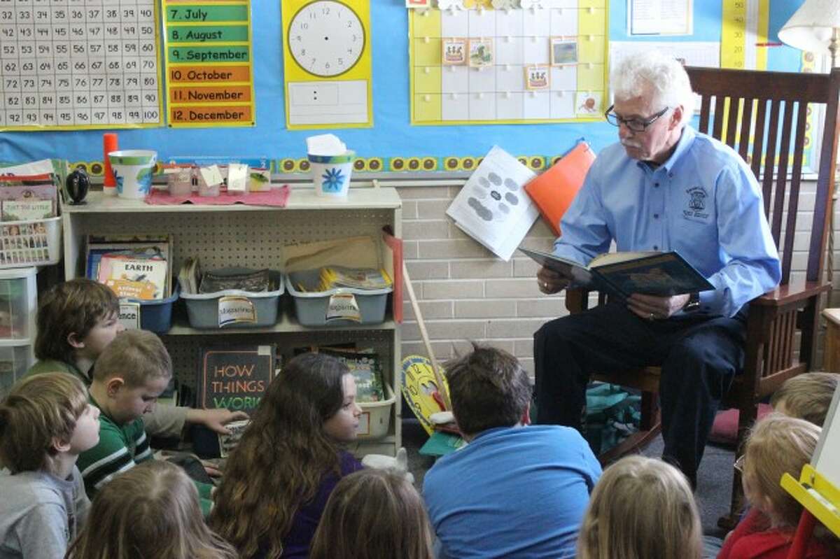 STORY TIME: State Senator Darwin Booher reads to the class at Frankfort Elementary School during his visit for Reading Month. The students voted on the story they wanted to hear the most. (Photo/Bryan Warrick)