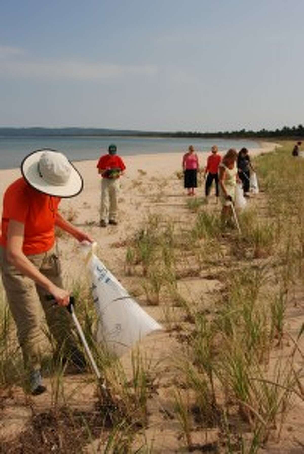 Volunteers clean up trash from Lake Michigan beach