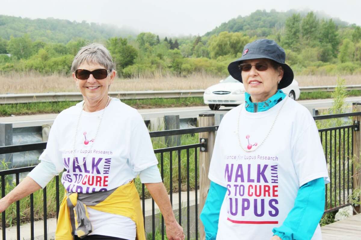 ROUNDING THE BEND: Barb Johnson and Nancy Marshall, of Team Trinity, finish the first leg of the walk, which takes participants along scenic Betsie Bay during the Frankfort Lupus Walk in Memory of Josephine VanHam held on June 1.