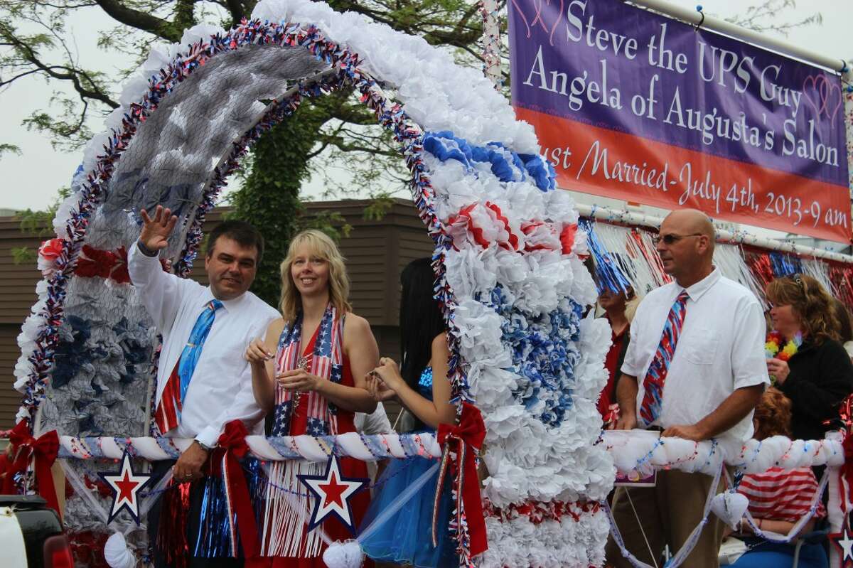 WEDDING DAY: Local celebrities Steve (The UPS Guy) and Angela Page (of Augusta’s Salon) were married earlier in the day before participating in the Fourth of July parade in Frankfort as grand marshals.