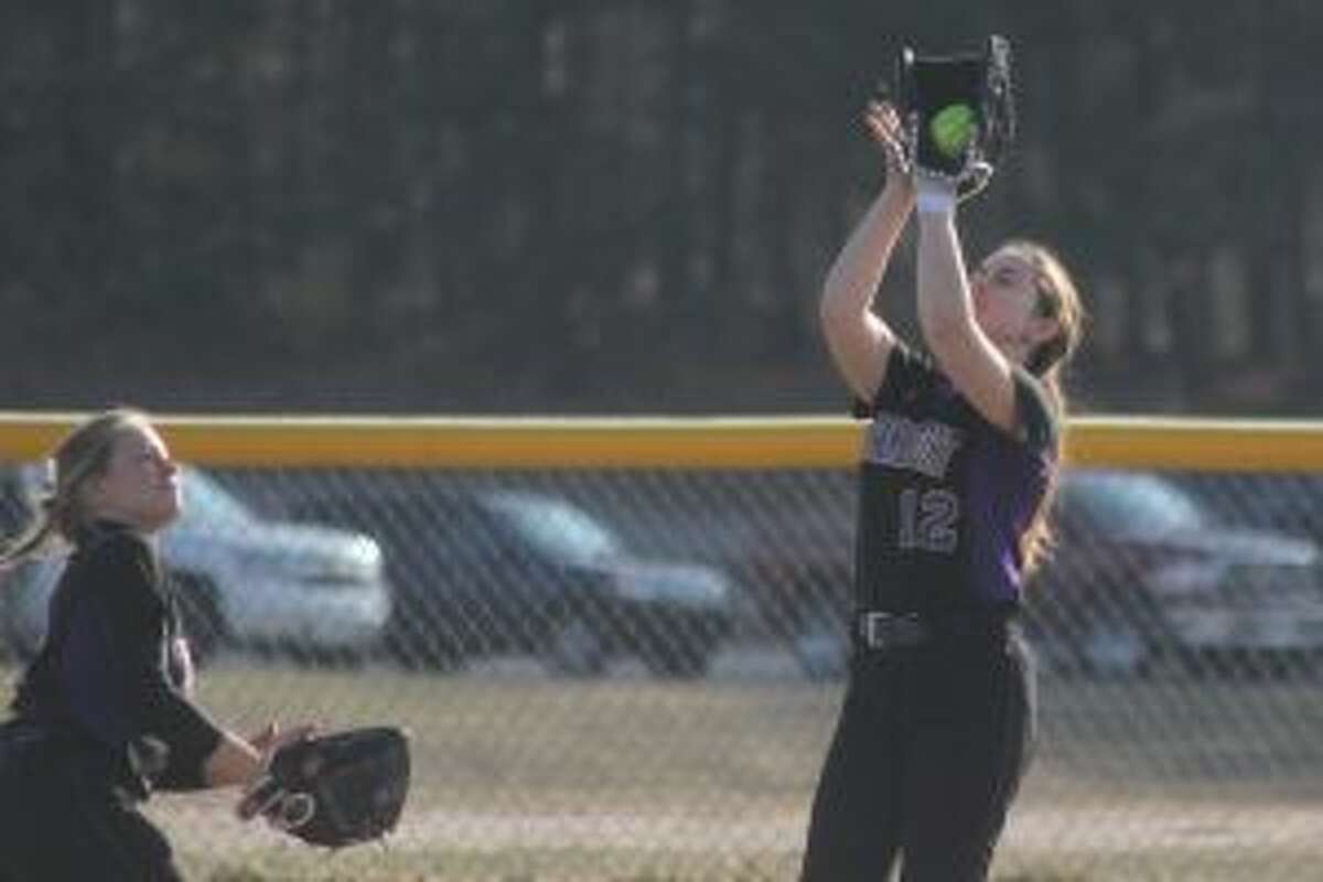 Cora Scott runs in from her right field position to catch a shallow fly ball. (Photo/Robert Myers)