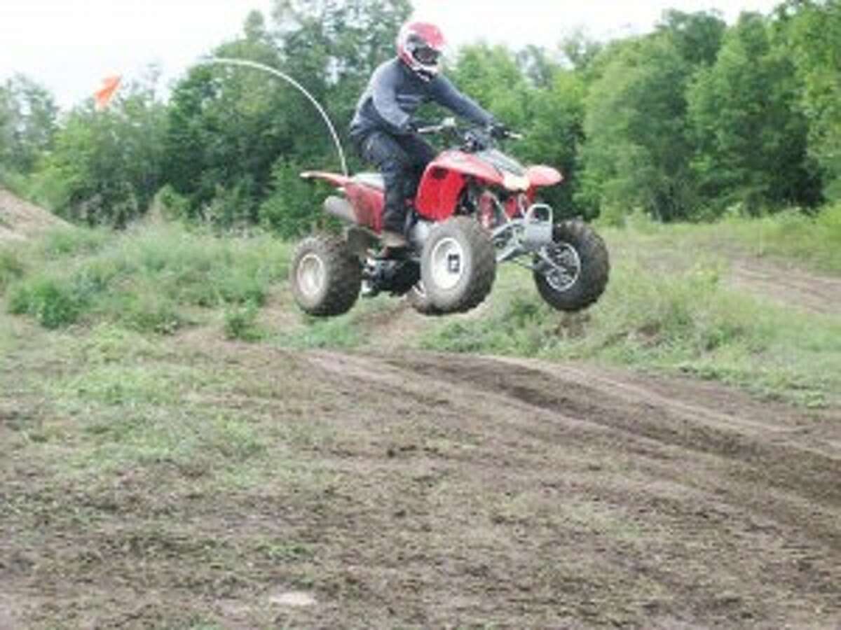 An ATV makes a high jump over a hill while riding a trail at the Twisted Trail Off Road Park. For the last five years, the park has allowed people to get some excitement from riding the trails safely.