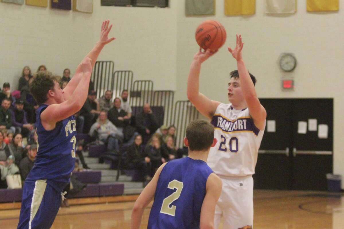 Jack Reznich tries a jumper from just inside the arc, as part of his 12-point effort in Frankfort's 44-42 overtime victory over Onekama. (Photo/Robert Myers)
