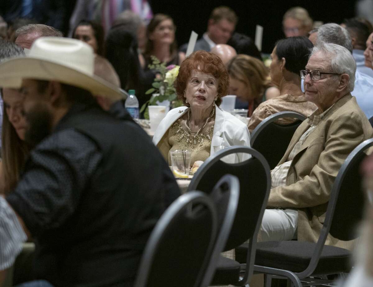 Guests read about and look over items available during the live auction 08/15/19 at the 19th annual Centers Stage presents an Evening with LaDainian Tomlinson. Tim Fischer/Reporter-Telegram