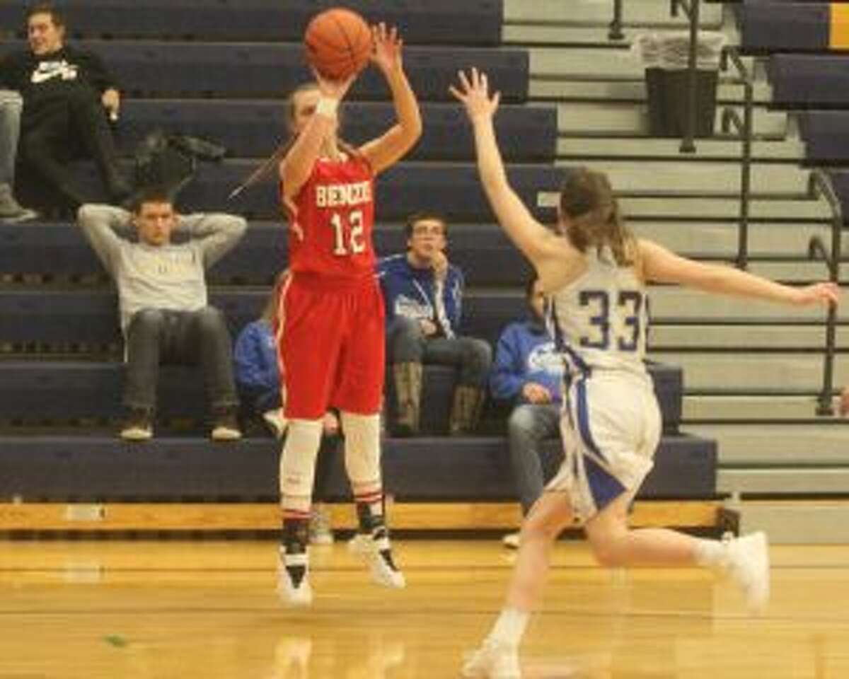 Benzie Central's Angie Warsecke takes a shot from behind the arc. (Photo/Robert Myers)