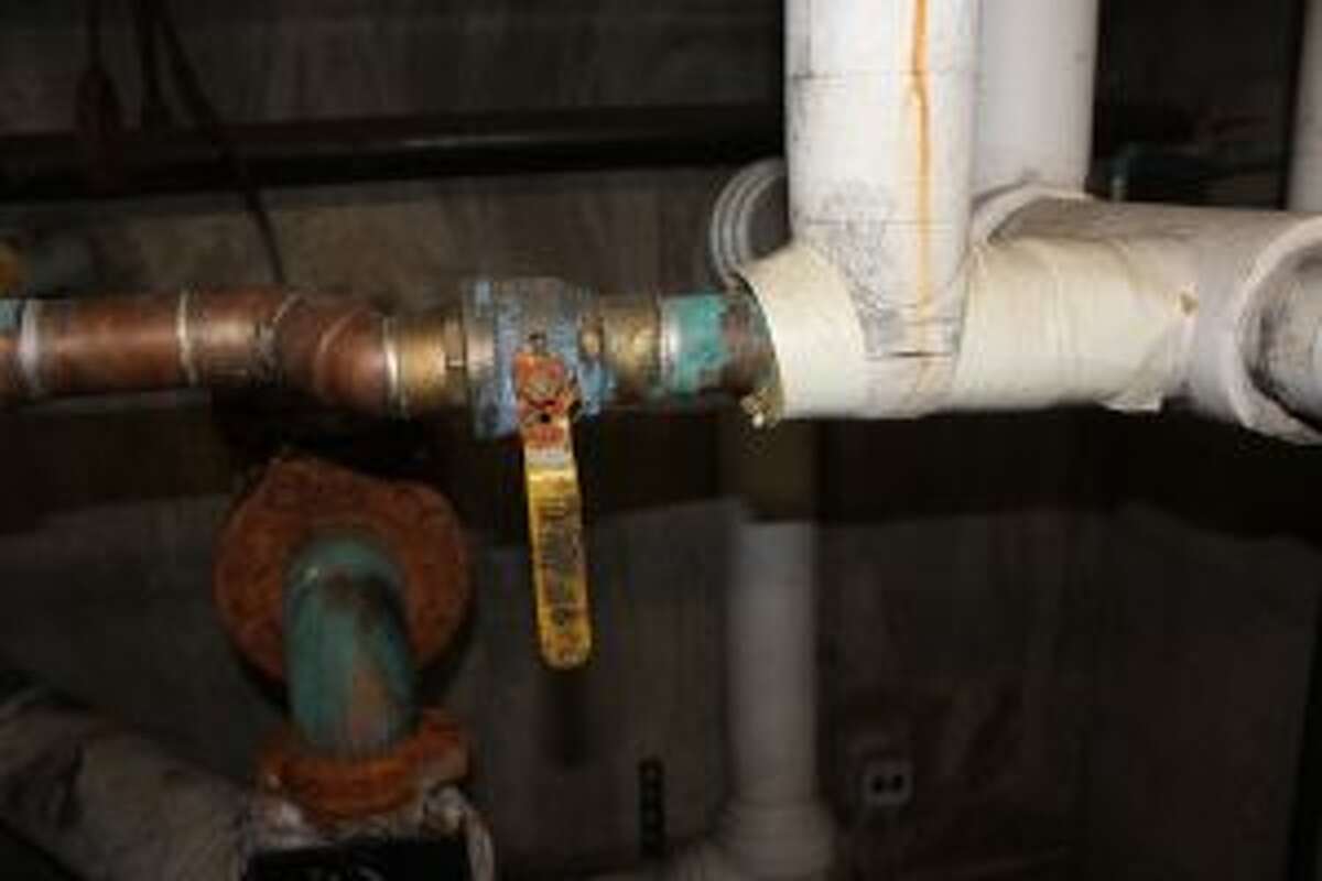 The rusted valves in the high school boiler room are near the top of the district's to do list. (Photo/Robert Myers)
