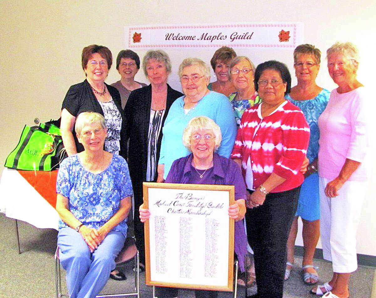MAPLES GUILD: Pictured, sitting, from left, Rena Rose and guild president Lou Laske holding The Maples Guild Charter Membership. Back row, Pat Blackmer, Nonie Rasmussen, Andre Emig, Lois Donovan, Judy Schelch, Liz Barlentos, Lucy DeGuia, Karen Rorick, Phyllis Chlebo. Not pictured Anne Harwood.
