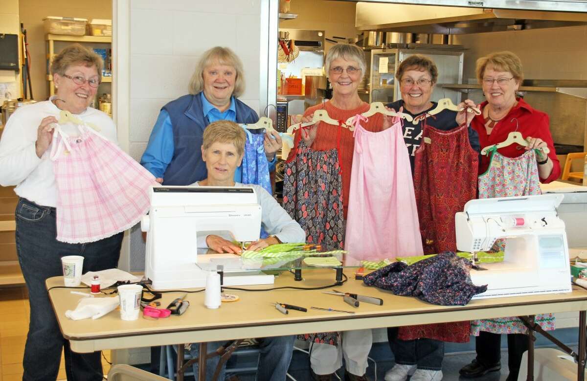 LITTLE DRESSES FOR AFRICA: St. Andrews dress makers, from left, are Mary Pilcher, Margaret Beery, Gretchen Amstutz, Ginny Daugherty, Nancy Carlson and Sue Long (sitting).