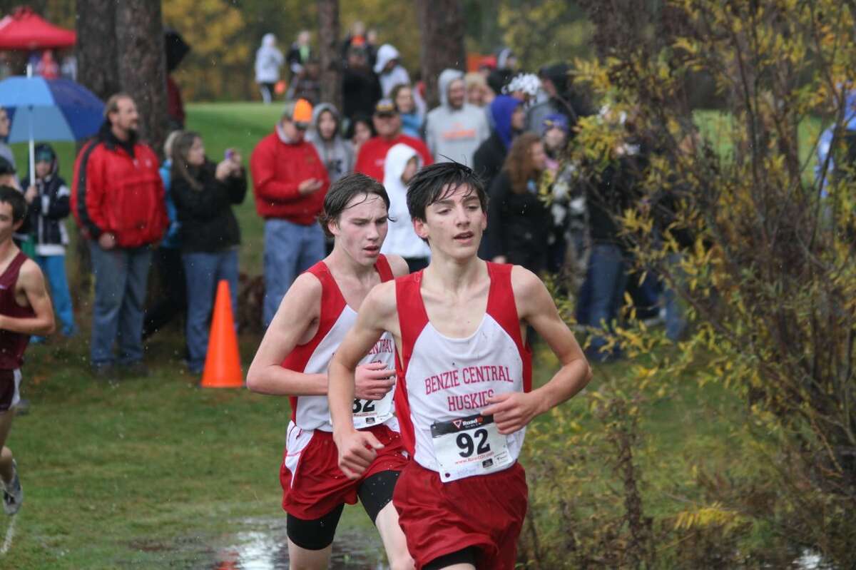 RAIN RUN: Noah Robotham (92) and Jared Bluhm ran great times despite the weather conditions for the game.