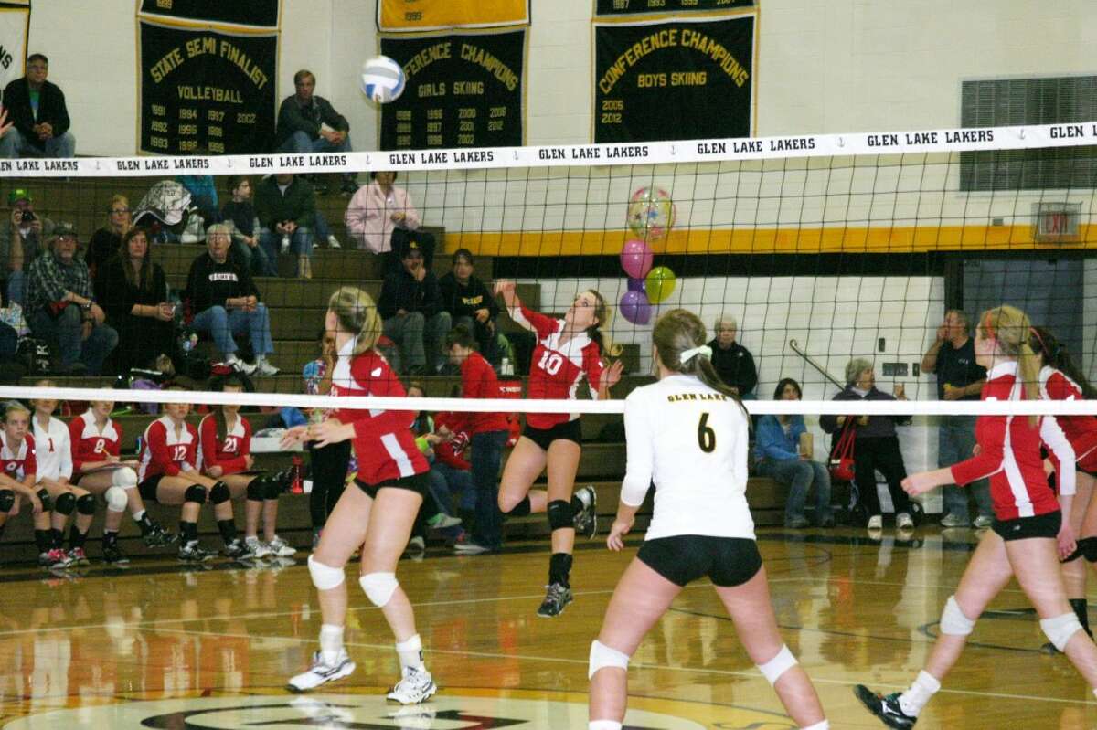 A QUICK RETURN: Senior Maggie Geetings (10) hits the ball over during the Huskie victory. (Photo/Bryan Warrick)