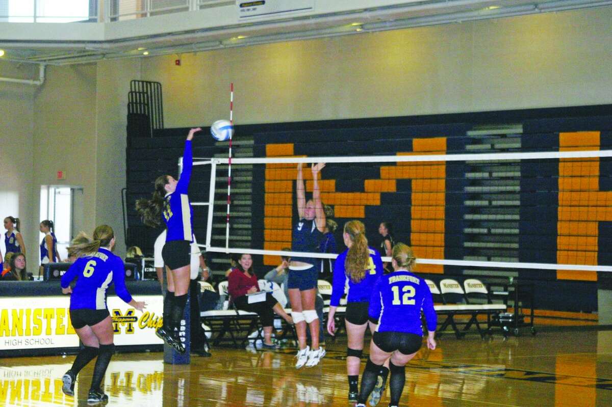 GOING FOR THE POINT: Co-Captain Catterall hits the ball over the net.
