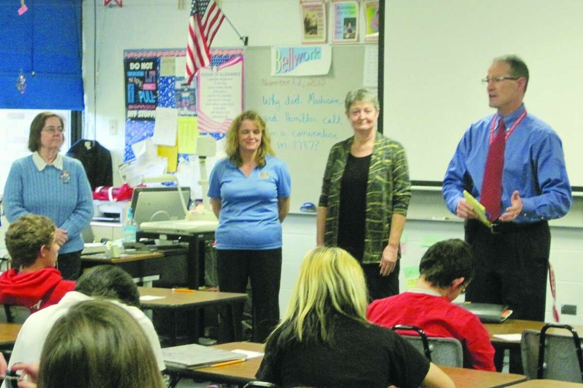 MAKING A DIFFERENCE: (ABOVE) 8th Grade Social Studies teacher Lynne Keber, Rotarians Kristi Kuhn and Linda Wood, and Principal David Clasen addressing Mrs. Keber’s class. (BELOW) Rotarian Andy Ashworth being questioned by three 8th graders in a mock job interview. (Photos/John Ester)