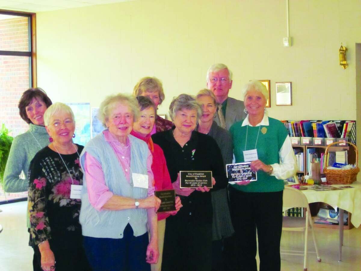 AWARD: Frankfort Mayor Robert Johnson honors Periwinkle Garden Club members with special plaques to be placed at gardens the club tends, as well as a special City of Frankfort Beautification Award. The club received the award for the thousands of hours of service they put in each year keeping area parks and gardens beautiful. (Courtesy photo)