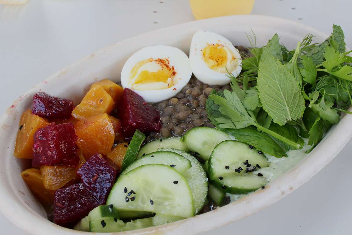 A beet and warm lentil salad with egg, yogurt, herbs and cucumber at Fava in Berkeley.