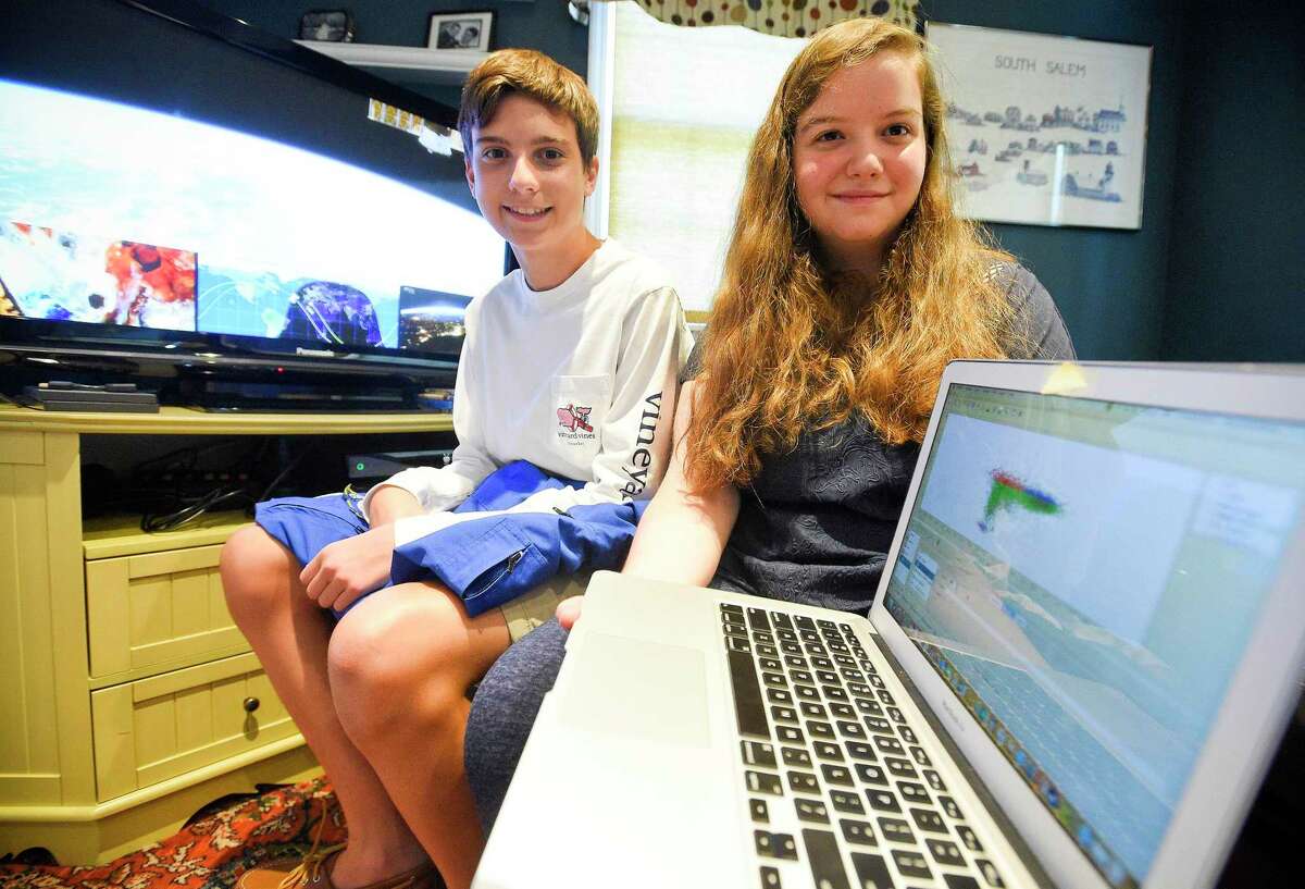 Academy of Information Technology and Engineering (AITE) students Kevin Fleischer and Anna Lichtenberg are photograph on Aug. 9, 2019 at Fleischer home in Stamford, Connecticut. Fleischer and Lichtenberg were among 13 selected NASA-sponsored high school students nationwide to participated in astronomical research at Caltech this summer.
