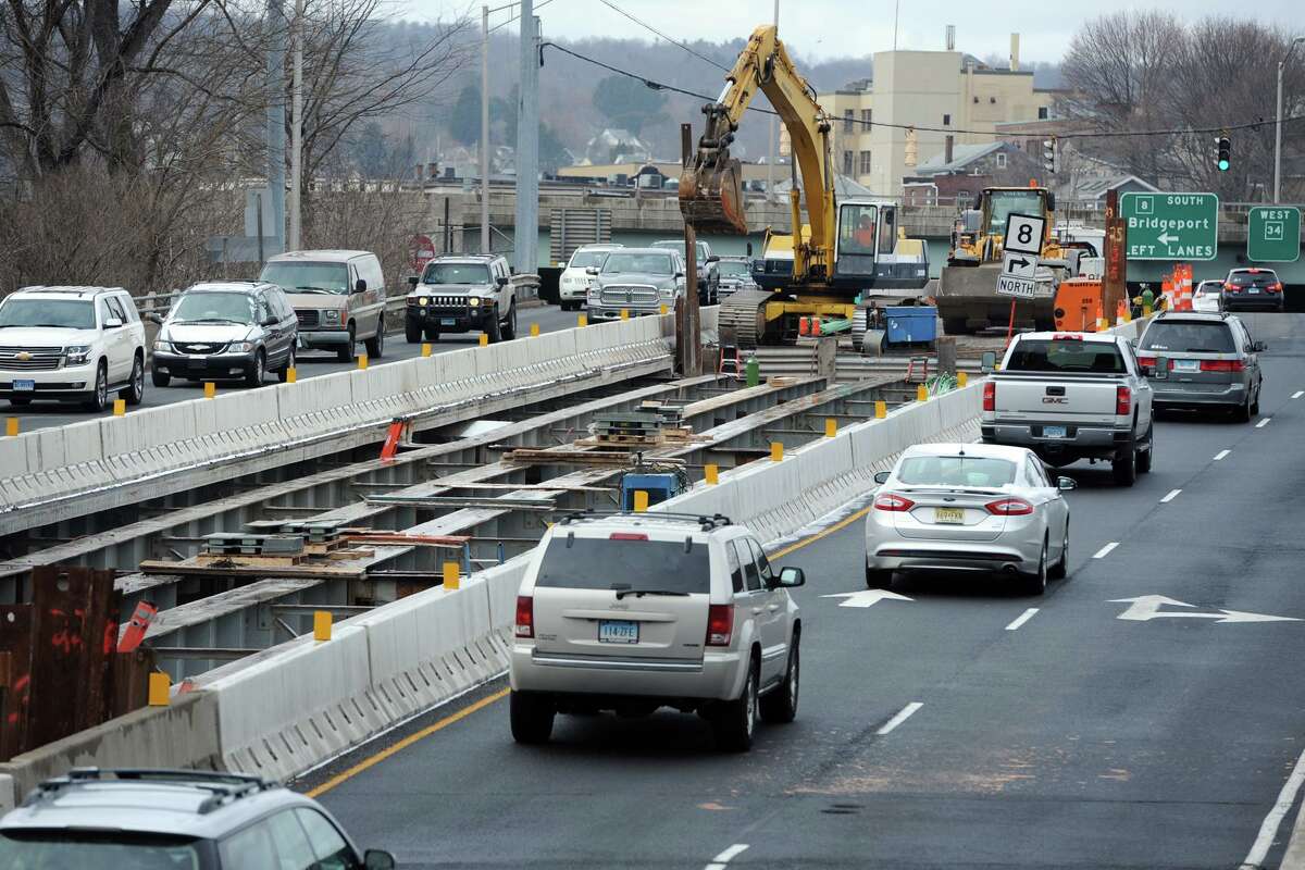 Traffic travels through the construction zone on the Main Street (Rt. 34) bridge, over the Naugatuck River, seen here looking toward downtown Derby.