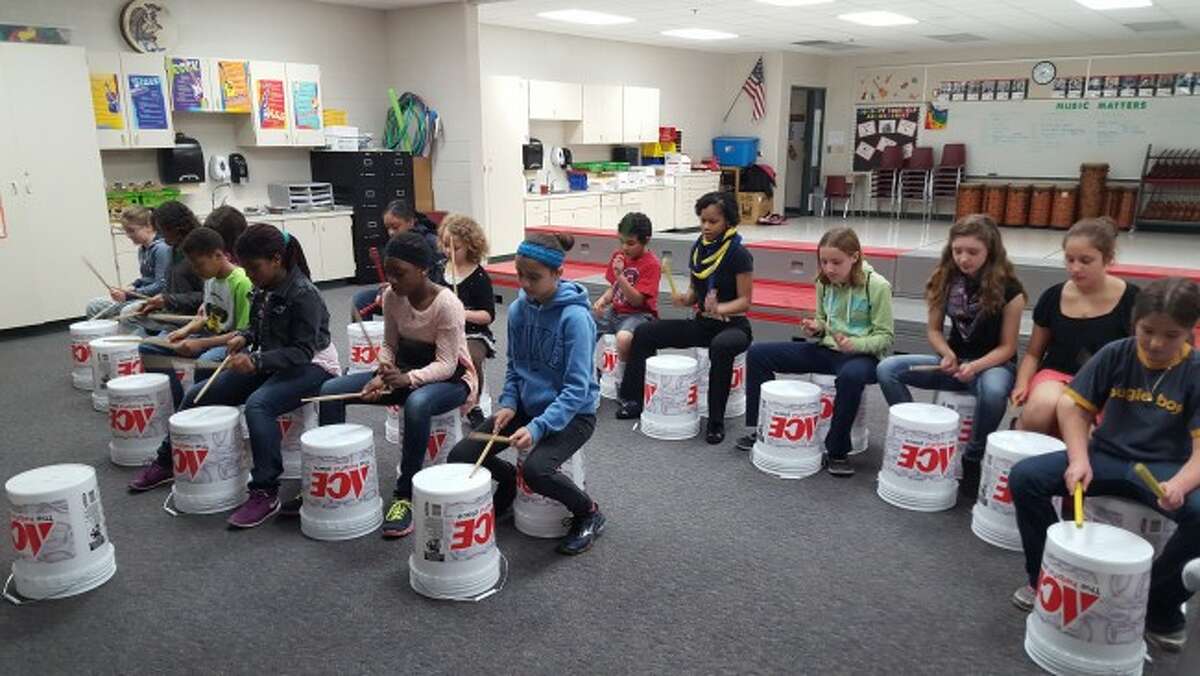Baldwin Elementary students learn to bucket drum