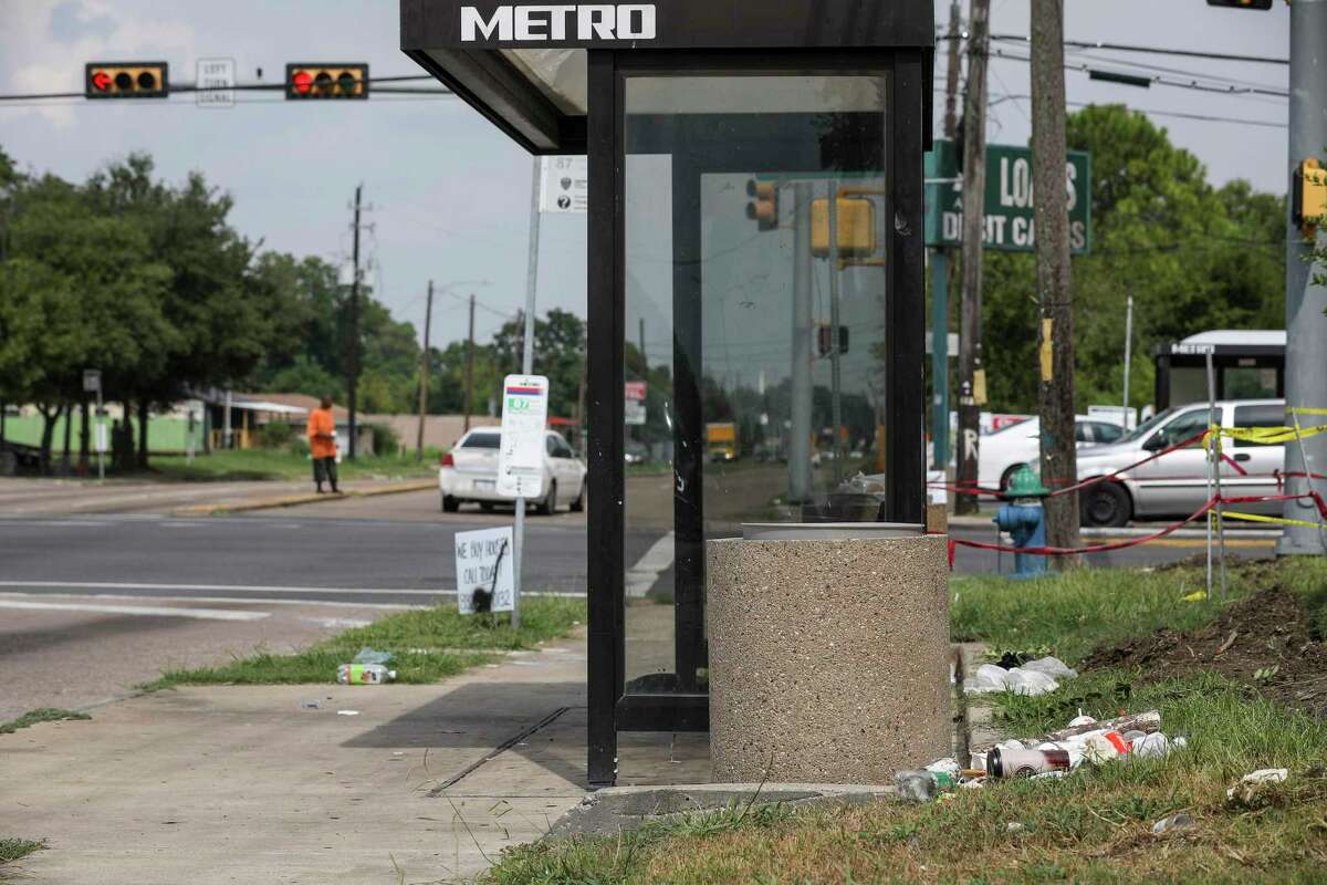 Trash sits on the ground at a bus stop at Reed Road and Cullen Boulevard on Aug. 15, 2019, in Houston. Metropolitan Transit Authority will triple its spending on cleaning and maintenance of stops so every stop is addressed, under a plan awaiting approval.