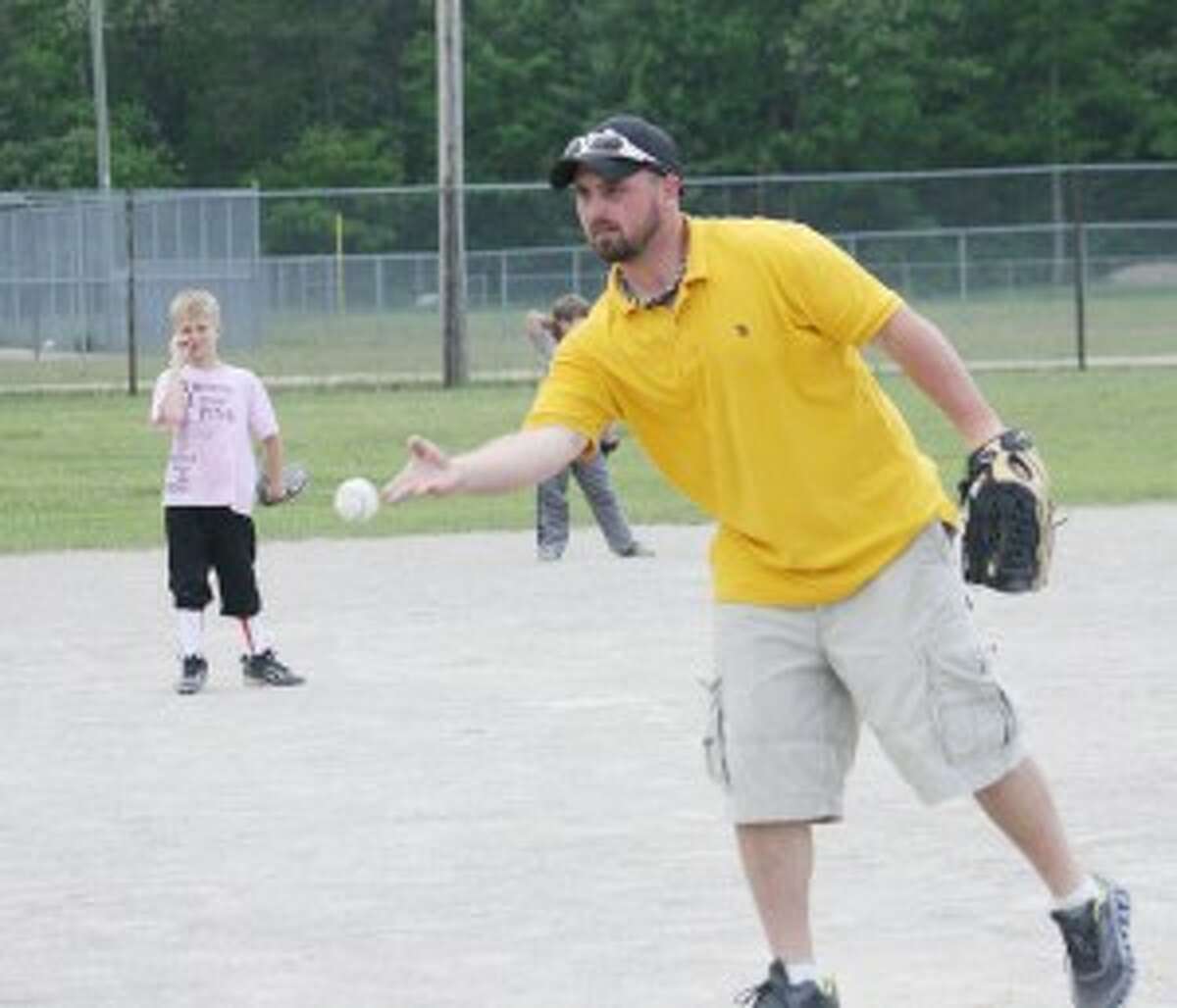 HERE IT COMES: Jason Moore pitches to one of the players Monday during Baldwin Youth League action. (Star/John Raffel)