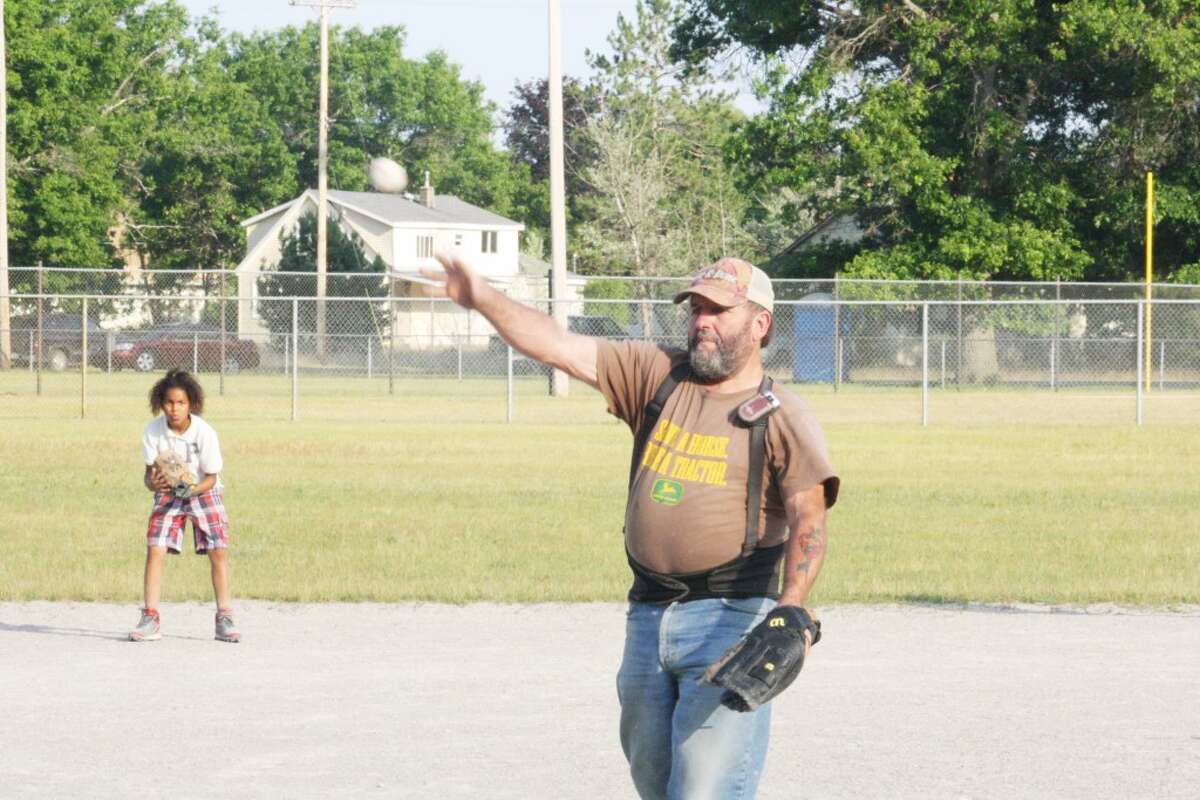 Up to bat: Baldwin Little League coach Bill Buckley delivers batting practice on Monday. (Star photo/John Raffel)